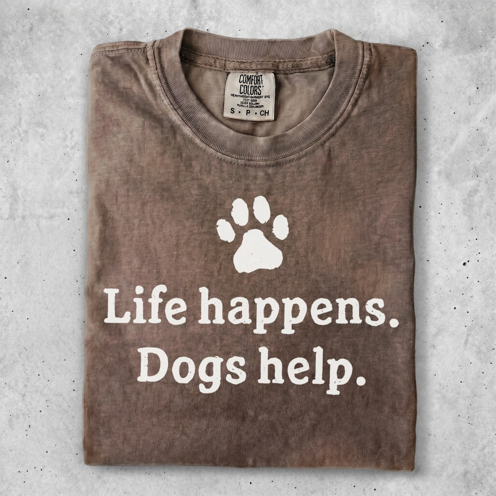 Brown t-shirt with "Life happens. Dogs help." and paw print graphic.