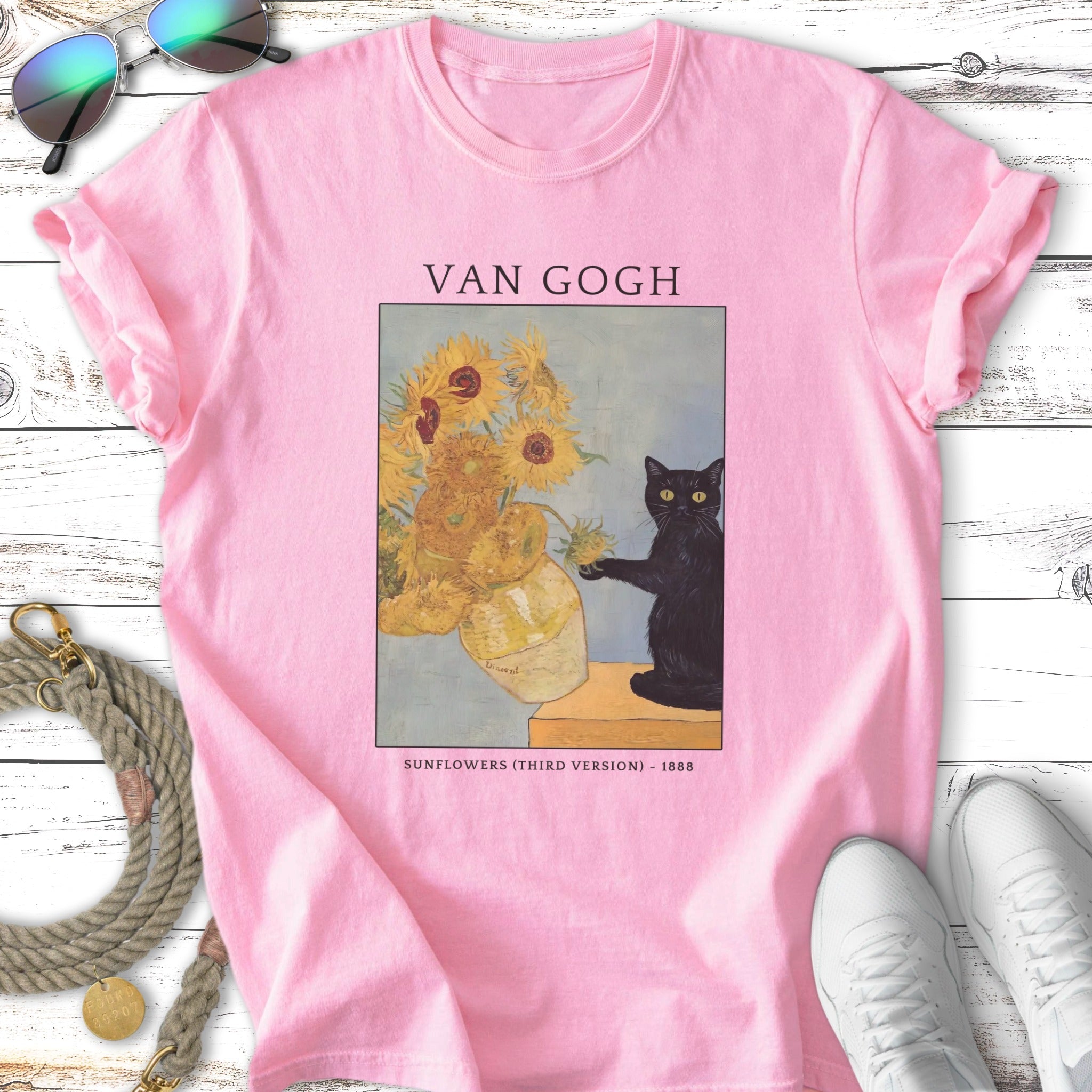 Van Gogh "Sunflowers (Third Version) - 1888" artwork with a black cat on a pink t-shirt.