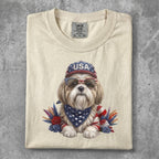 Shih Tzu dog wearing USA hat and bandana with sunglasses and feathers.