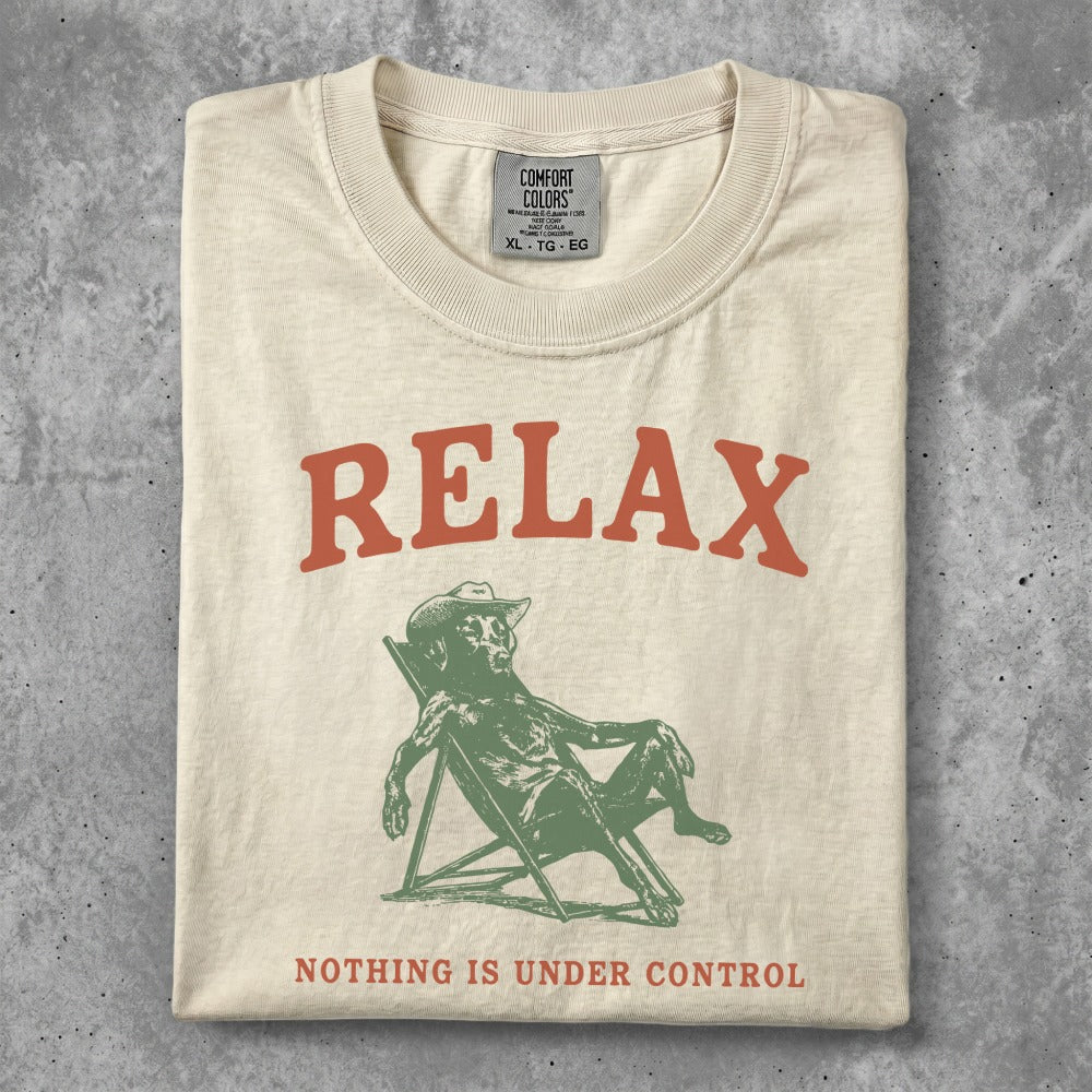 T-shirt with "RELAX NOTHING IS UNDER CONTROL" text and reclining figure.