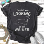 Black t-shirt with dachshund silhouette and text "I CAUGHT YOU LOOKING AT MY WEINER".