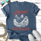 Distressed t-shirt with chicken, cat, and barn graphic, reads "Local Egg Dealer".