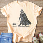 Darth Vader walking an AT-ST walker on a leash, vintage graphic on a peach t-shirt.