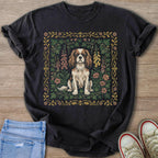 Dark t-shirt with a framed Cavalier King Charles Spaniel amongst flowers and foliage.