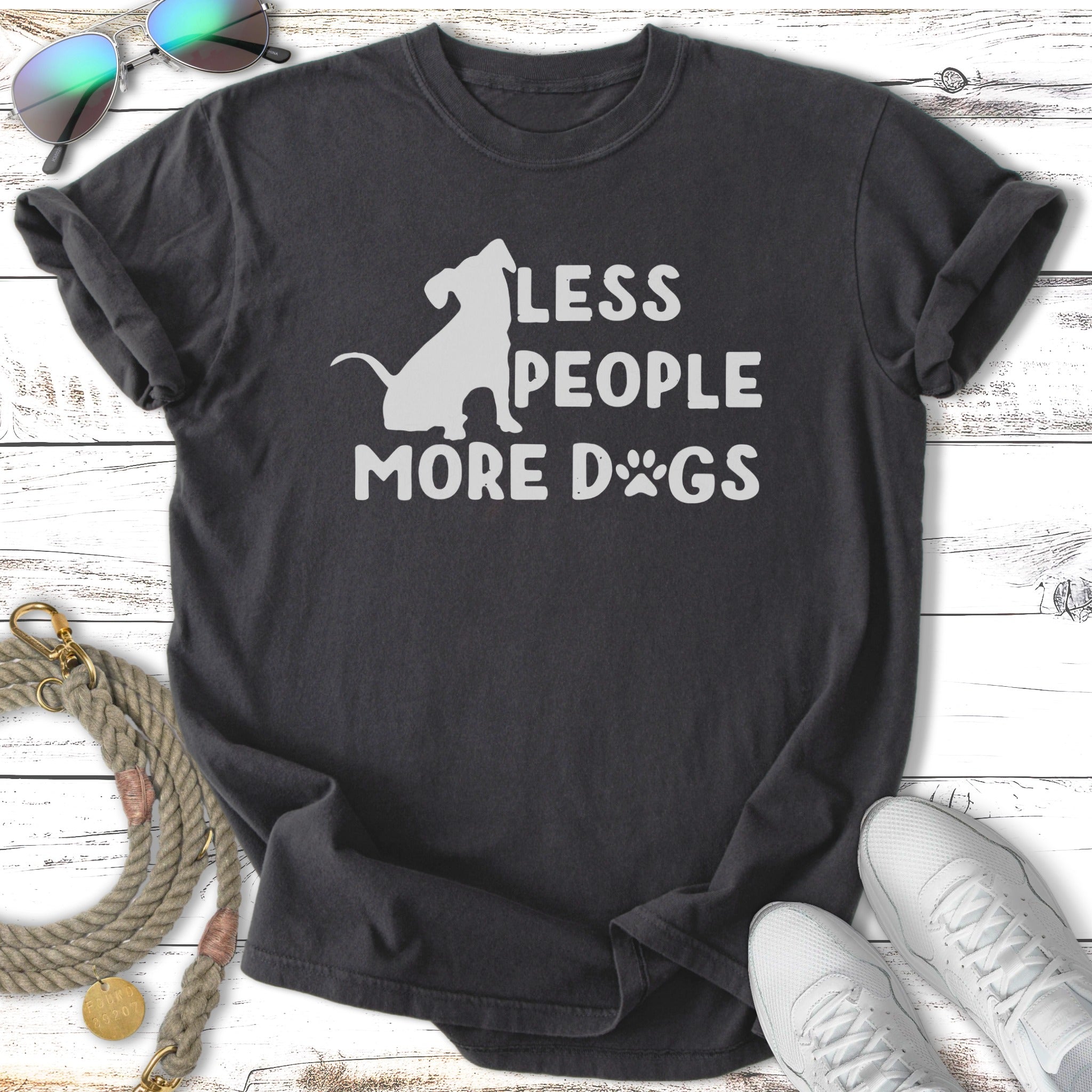 Dark t-shirt with "LESS PEOPLE MORE DOGS" text and a dog silhouette.