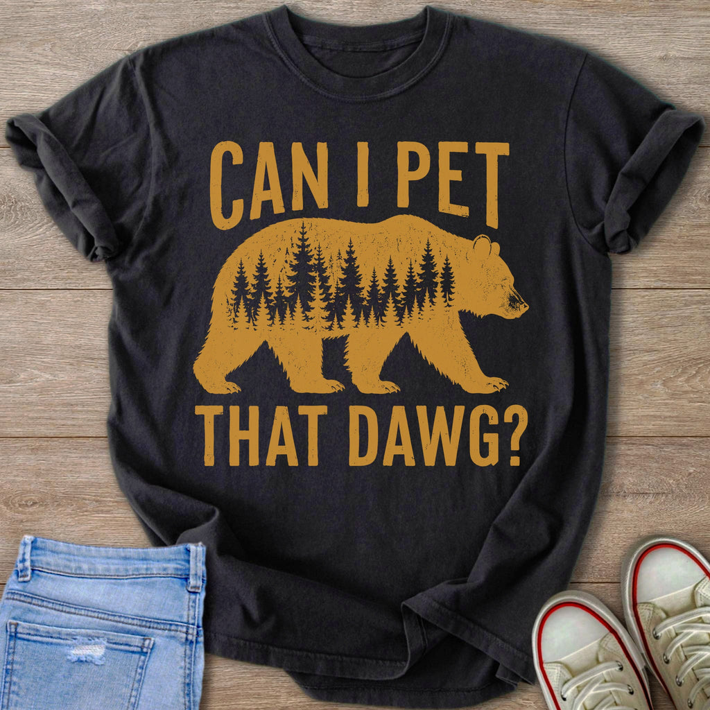 Dark t-shirt with distressed graphic of a bear silhouette filled with pine trees and text.