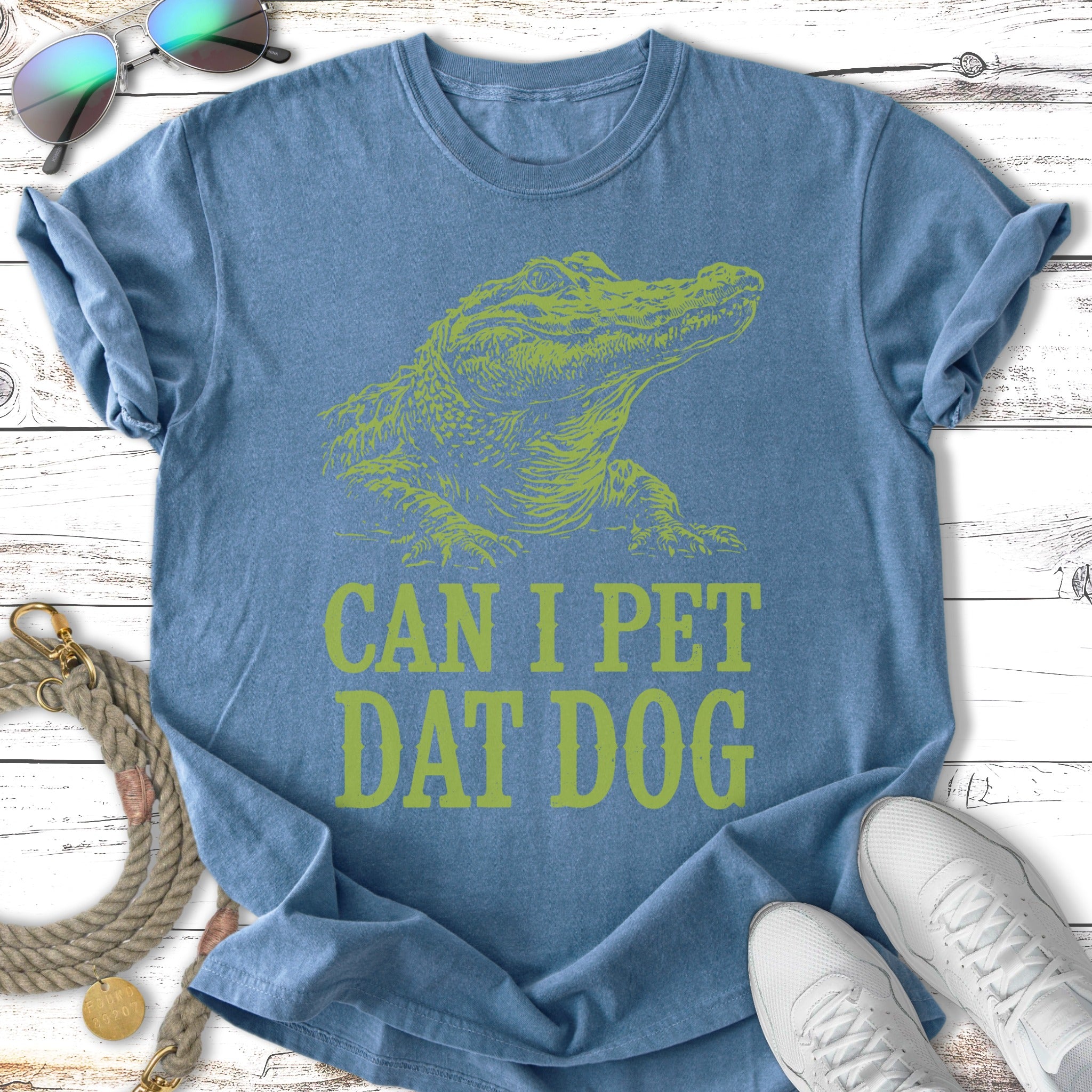 Green alligator graphic with text "CAN I PET DAT DOG" on a blue t-shirt.
