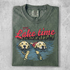 Green t-shirt with "It's Lake Time" text and two dogs swimming.