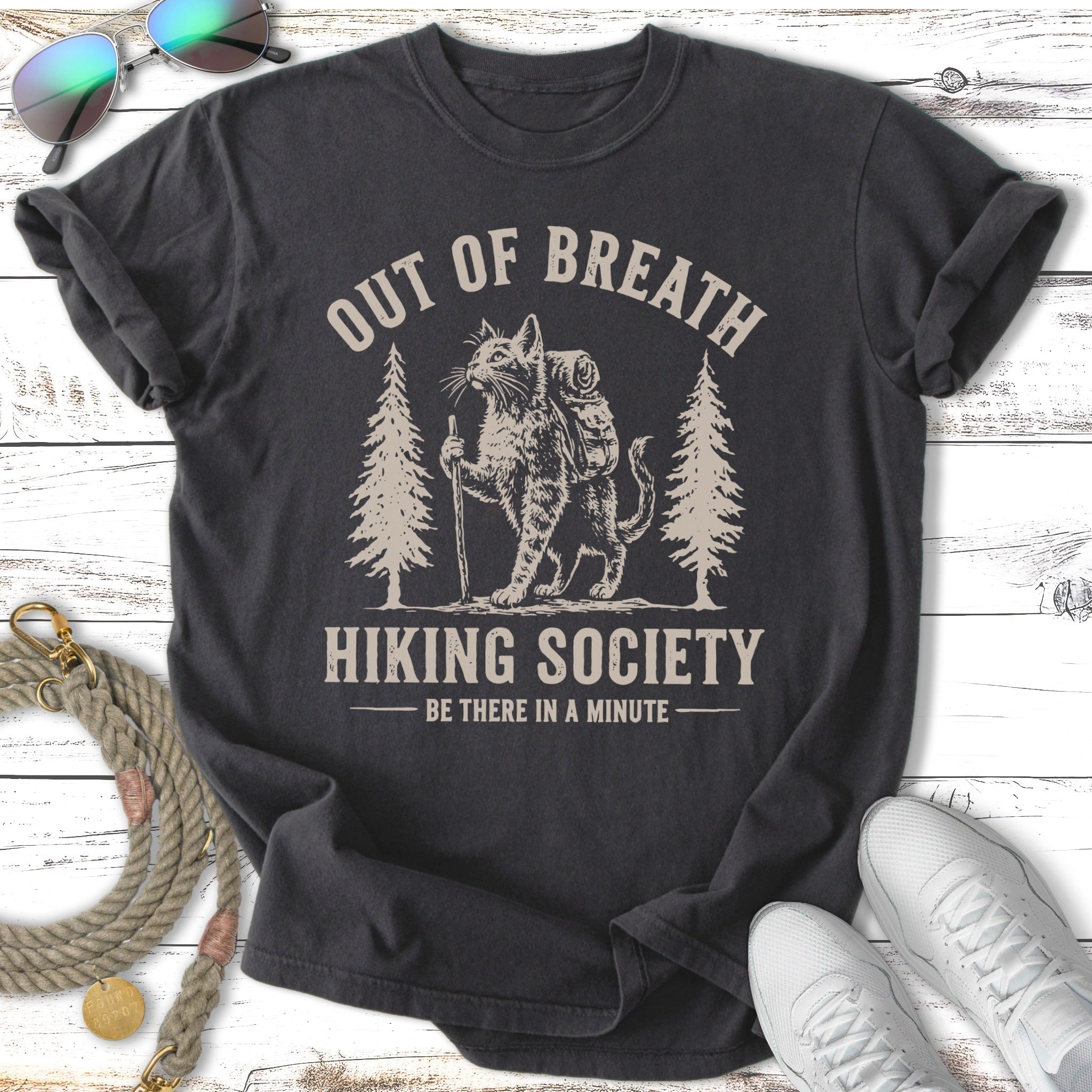 T-shirt with a cat wearing a backpack, text "Out of Breath Hiking Society".