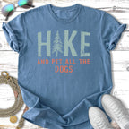 Blue t-shirt with "HIKE AND PET ALL THE DOGS" text and a pine tree graphic.