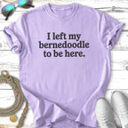 Lavender t-shirt with text "I left my Bernedoodle to be here."