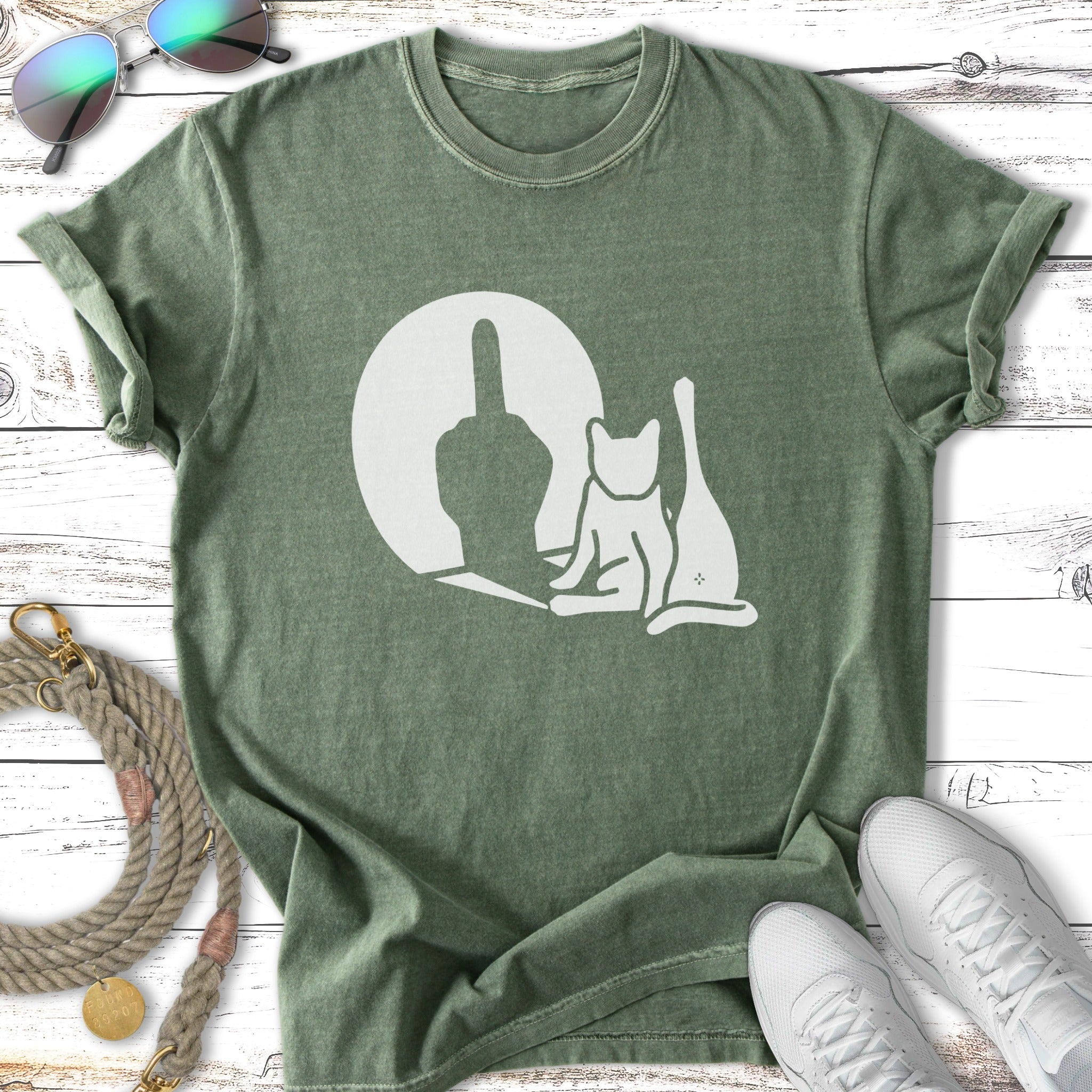 Green t-shirt with white cat silhouette giving middle finger.