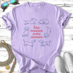 Light purple t-shirt with line drawings of dachshunds and text "less meanies more weenies".