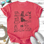 T-shirt with an illustration of nine different cats in varying poses.