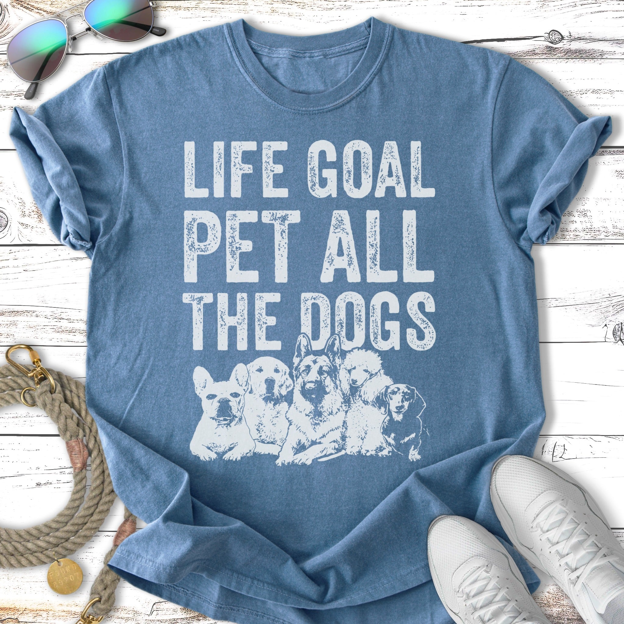 T-shirt with "Life Goal Pet All the Dogs" text and illustration of dogs.