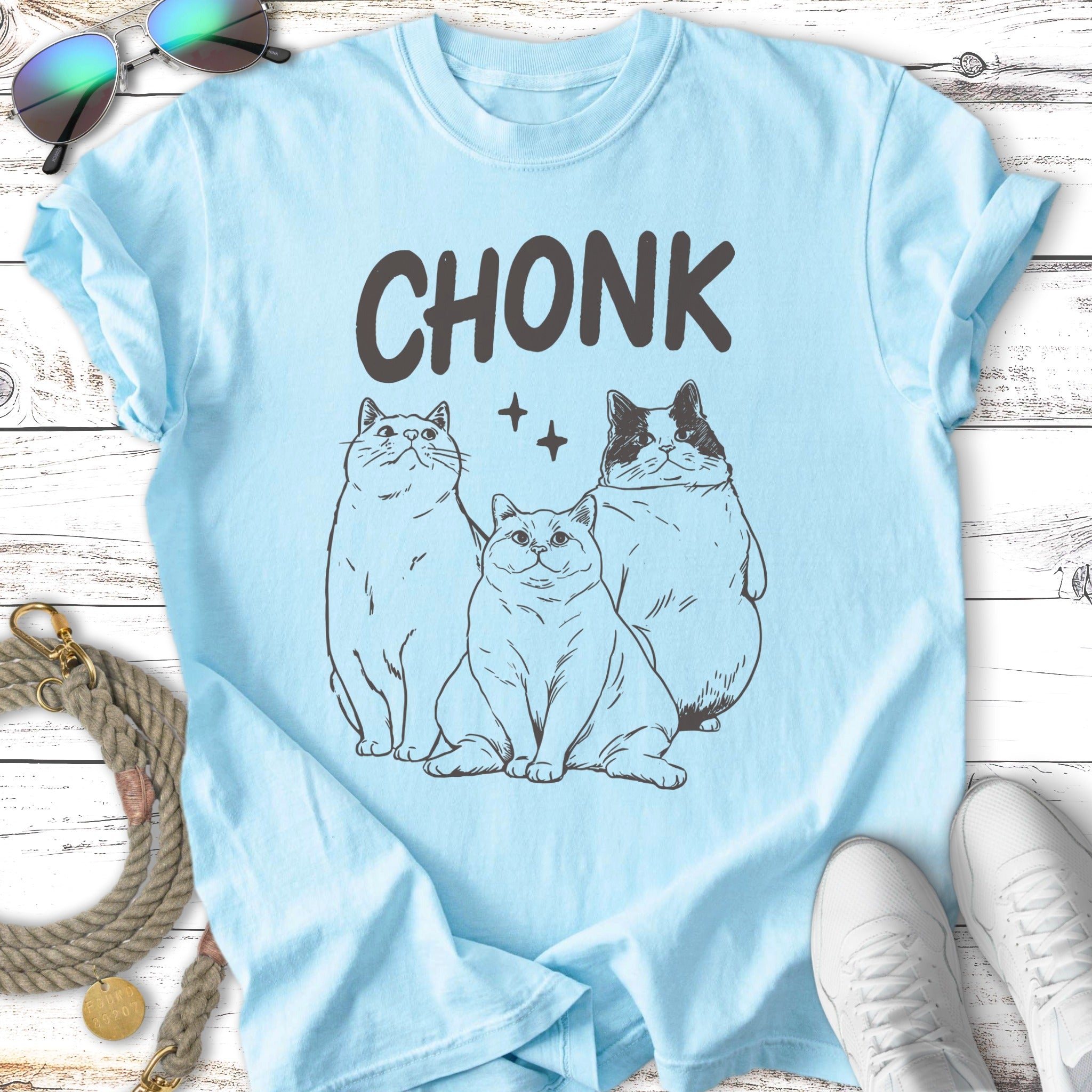 Light blue t-shirt with three cartoon cats and the word "CHONK"