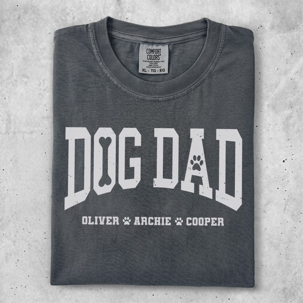 Dark gray t-shirt with "DOG DAD" and bone graphic.
