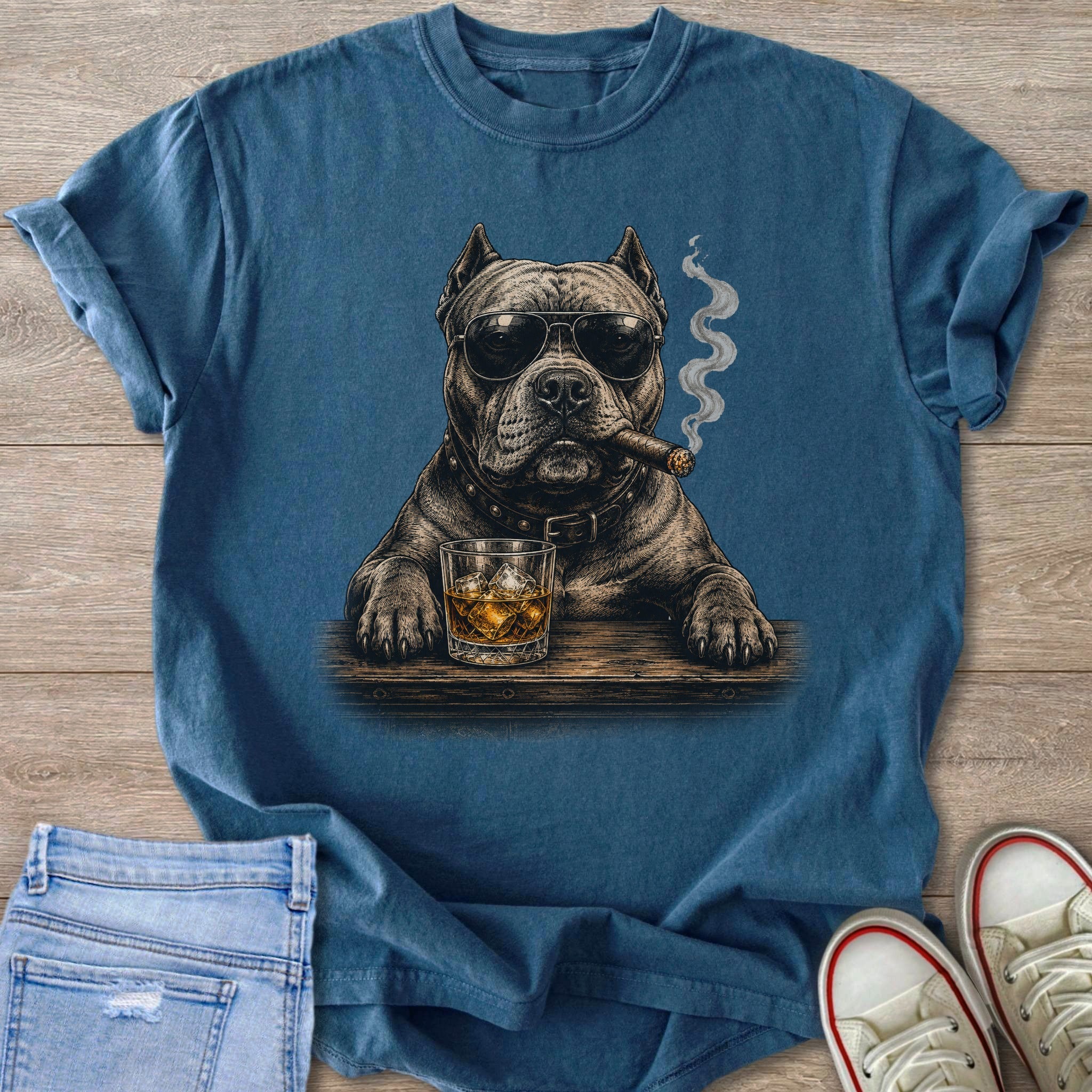 Dog wearing sunglasses, smoking cigar, with glass of whiskey on wooden table.