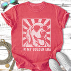 Golden Retriever wearing sunglasses with sunburst behind, "In My Golden Era" text.