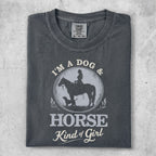 T-shirt with woman on horse and dog, text "I'm a dog & horse kind of girl."