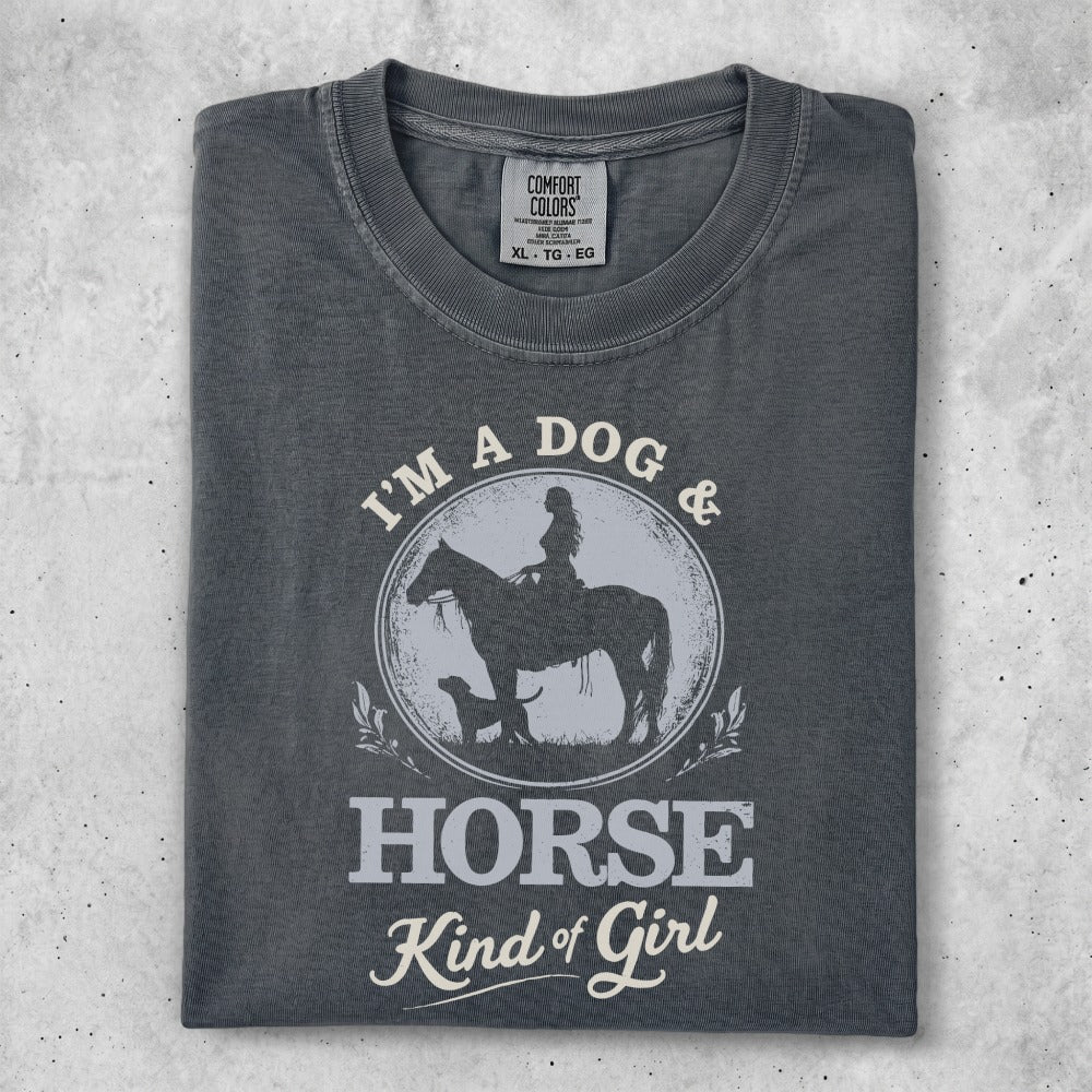T-shirt with woman on horse and dog, text "I'm a dog & horse kind of girl."