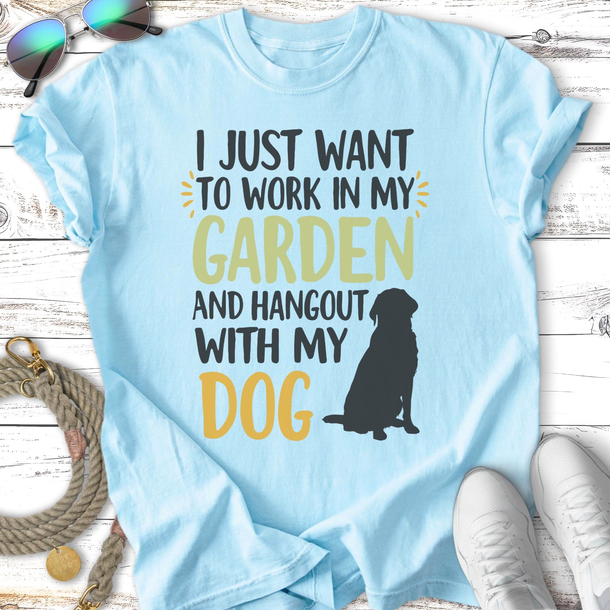 Light blue t-shirt with "I JUST WANT TO WORK IN MY GARDEN AND HANGOUT WITH MY DOG" and a dog silhouette.