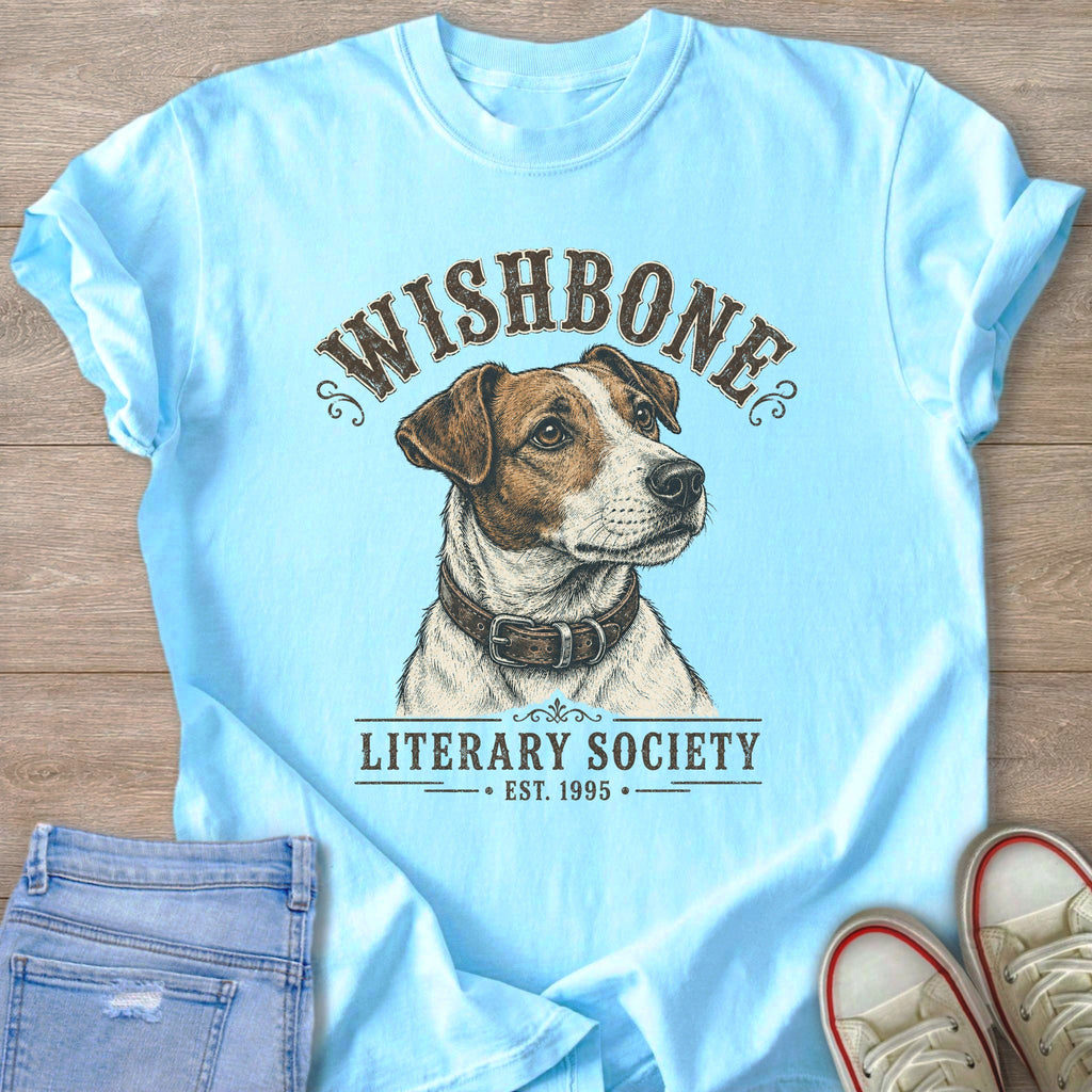 Light blue t-shirt with a Jack Russell terrier and text "WISHBONE LITERARY SOCIETY EST. 1995".