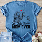 Blue t-shirt with a Cocker Spaniel giving a high-five and text reading "Best Cocker Spaniel MOM EVER."