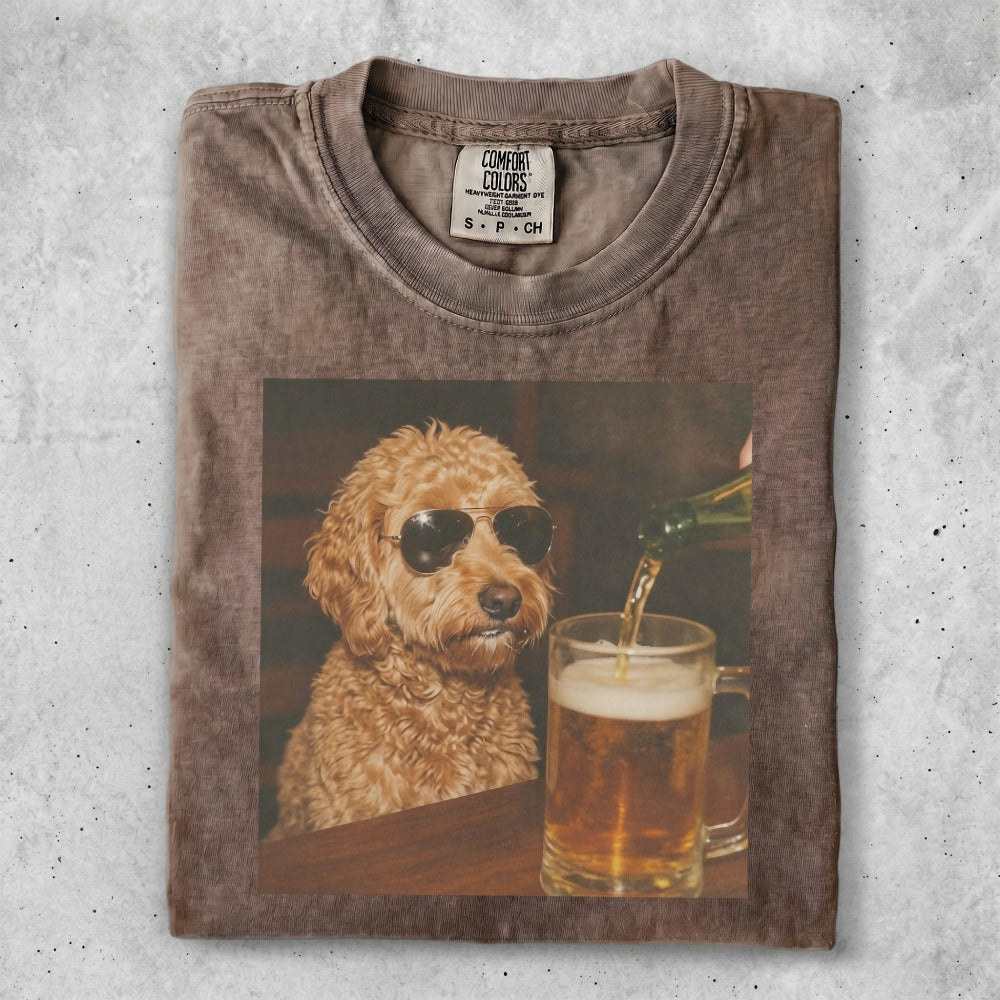 Brown t-shirt featuring a poodle wearing sunglasses next to a mug of beer.