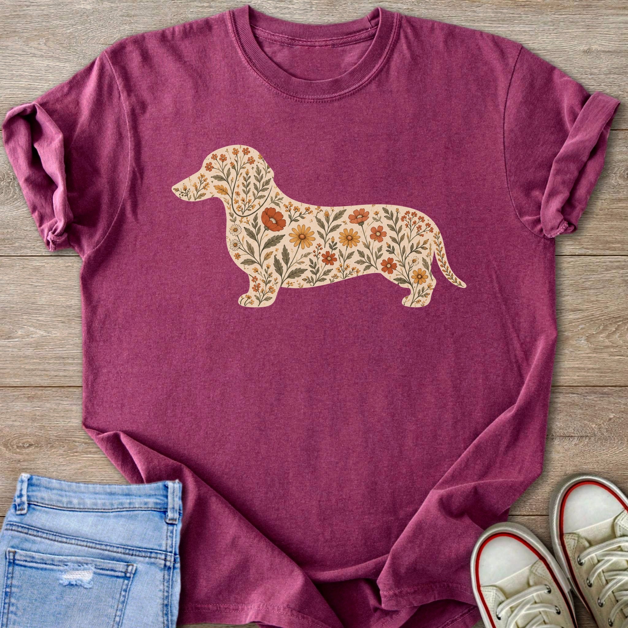Magenta t-shirt with dachshund silhouette filled with floral pattern.