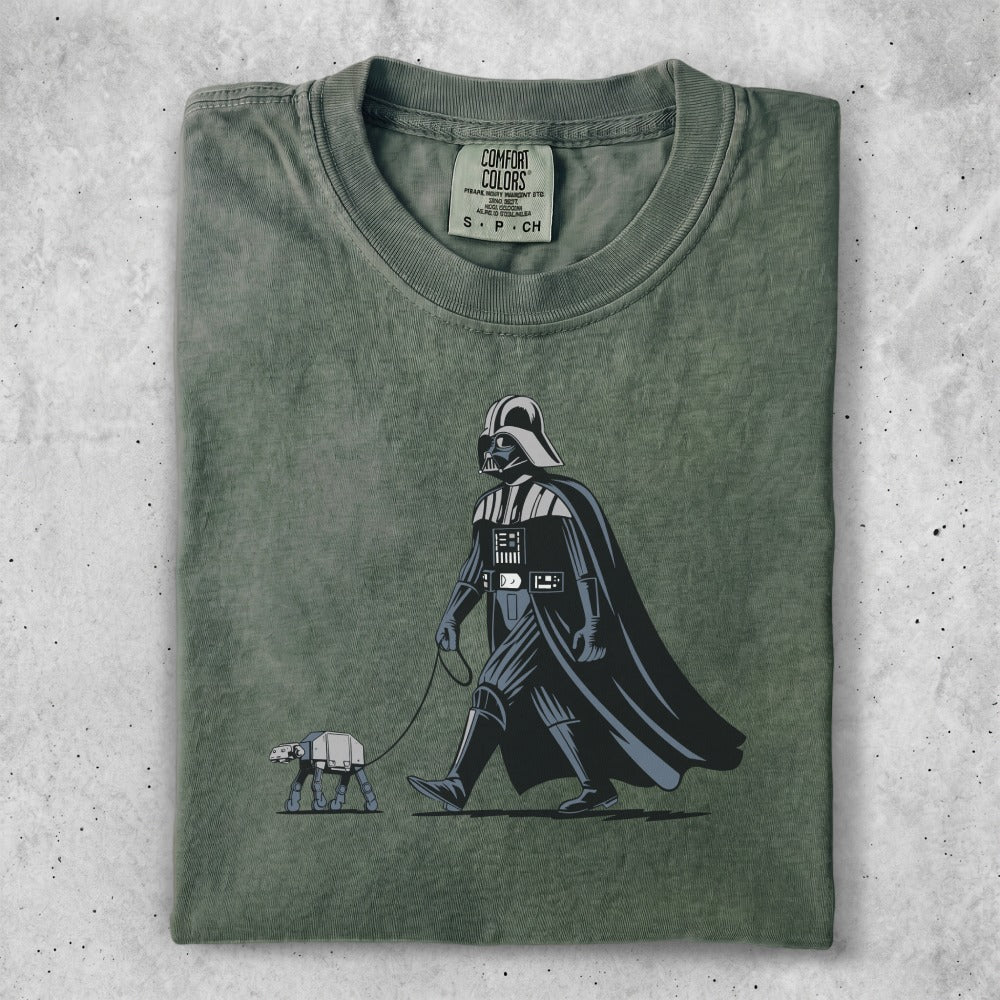 Darth Vader walking an AT-AT on a leash.