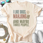 Cream t-shirt with "I like dogs, mahjong and maybe three people" text.