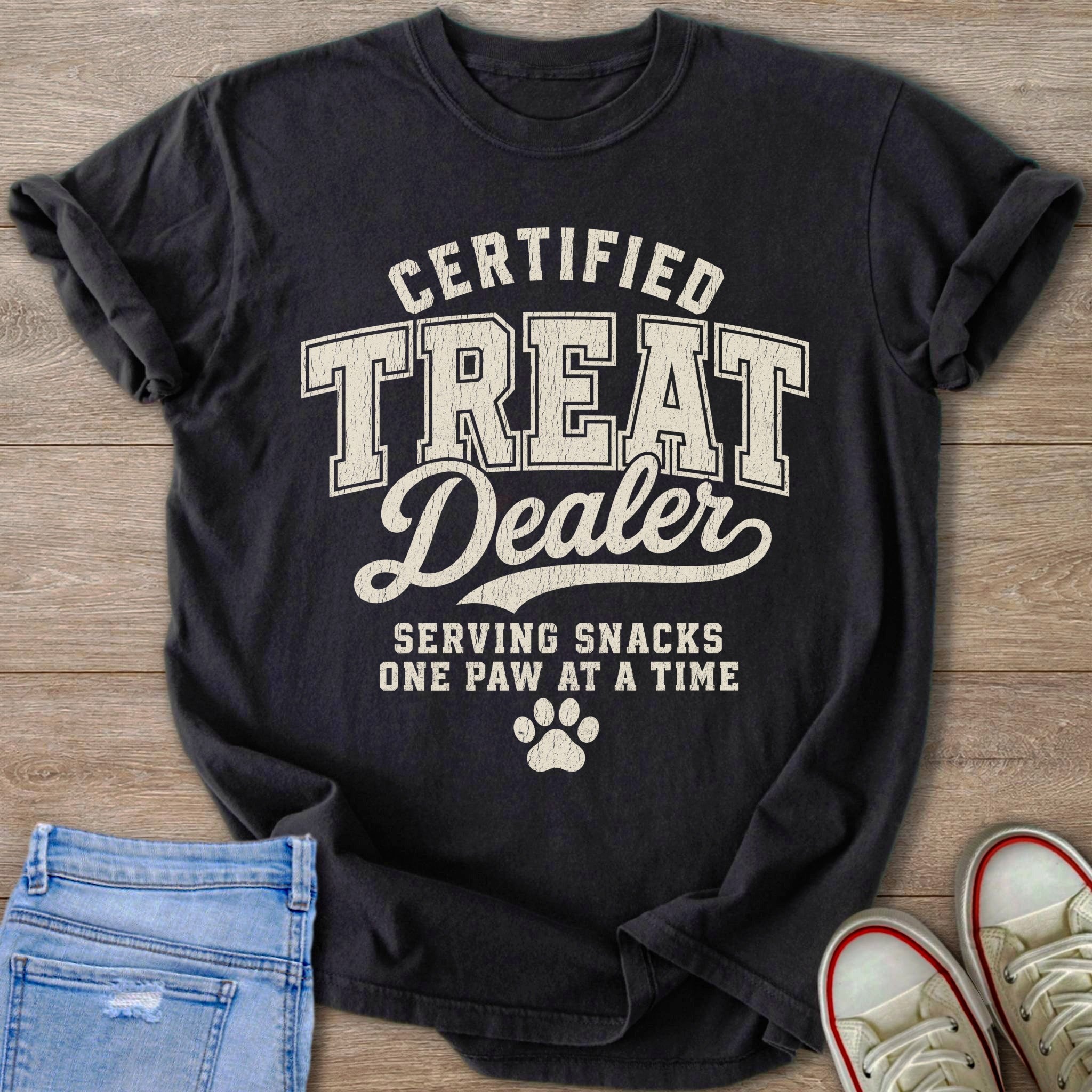 Black t-shirt with text "Certified Treat Dealer, Serving Snacks One Paw At A Time".