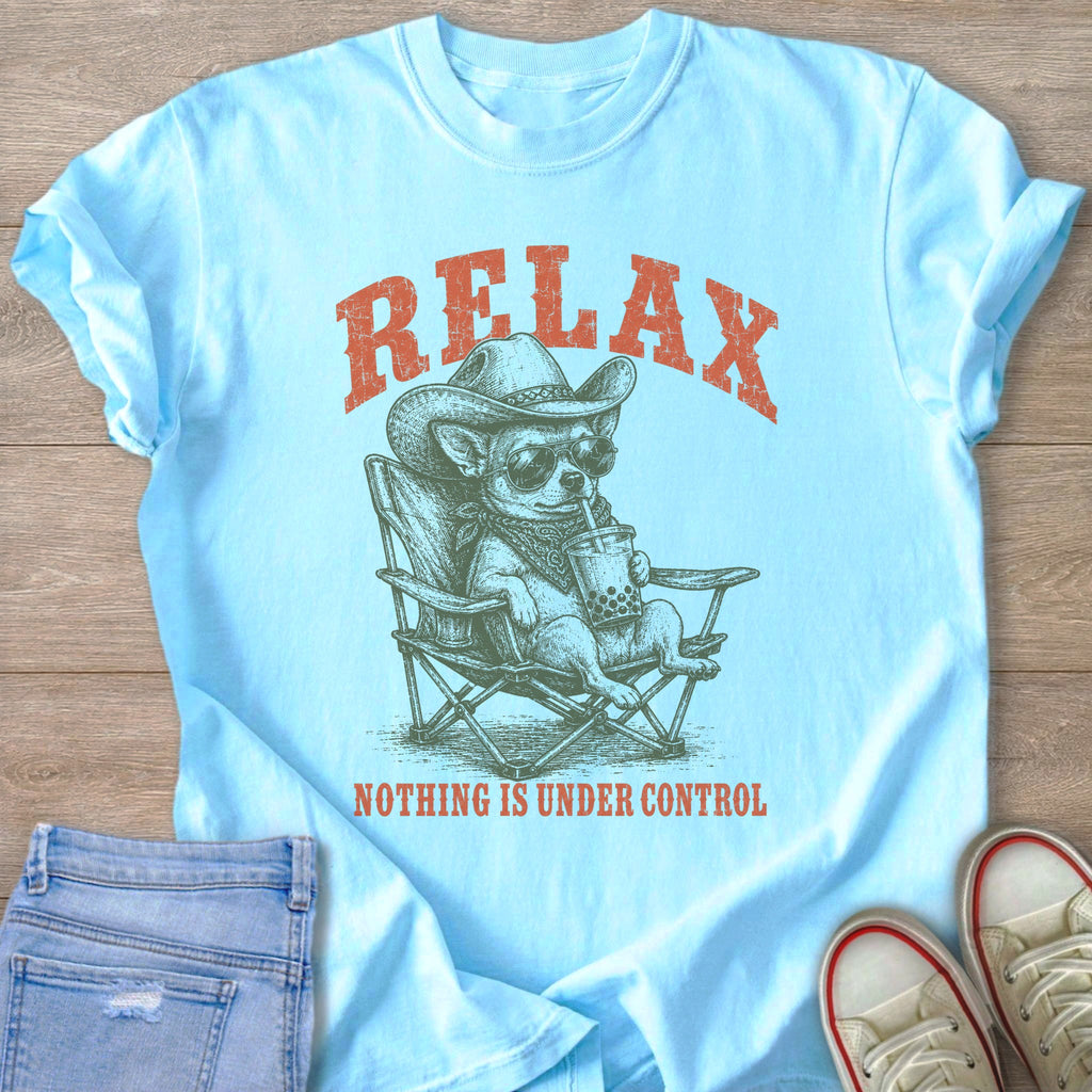 Pale blue t-shirt with a graphic of a chihuahua in a cowboy hat drinking boba tea and the text RELAX.