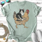 Black and white cat sitting on a stylized brown chicken.