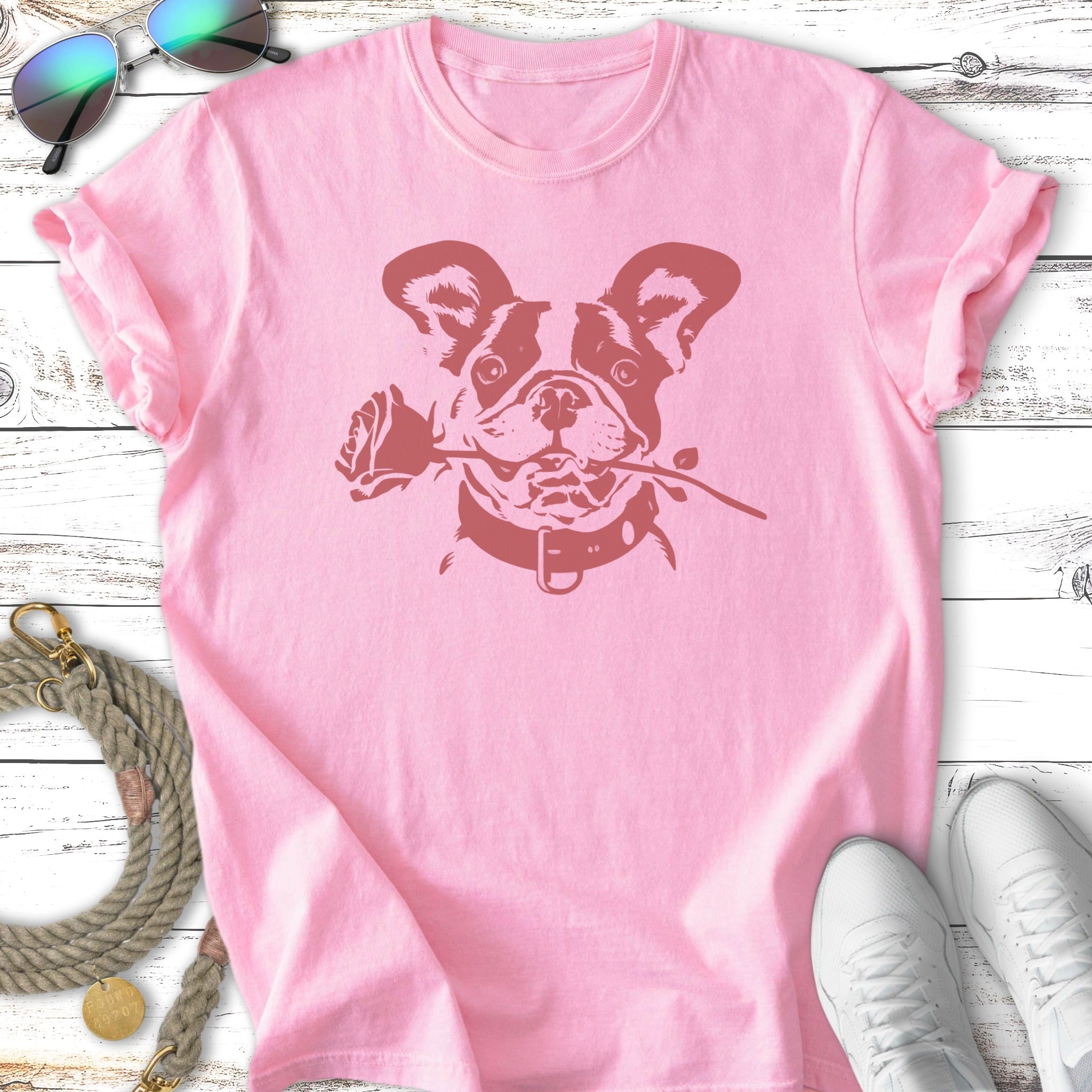 Pink t-shirt with a French bulldog holding a rose in its mouth.