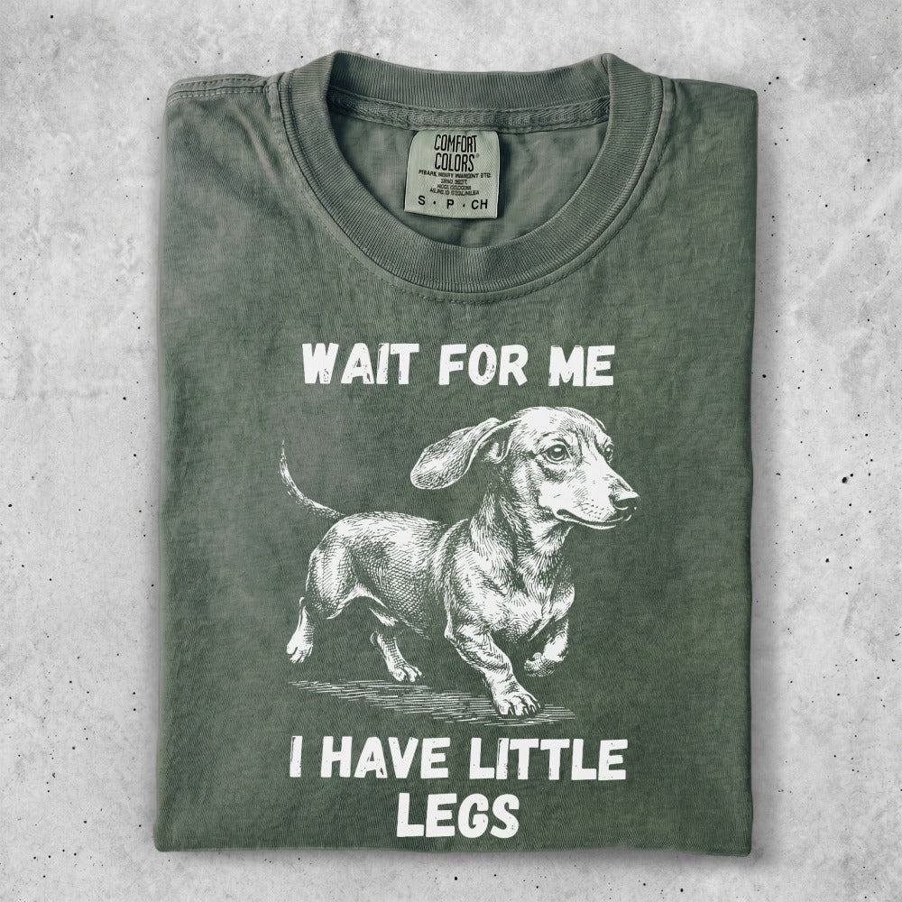 T-shirt with dachshund illustration and text "Wait for me, I have little legs."