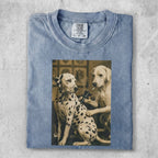 Dalmatian and yellow lab dog receiving tattoos on a faded blue t-shirt.