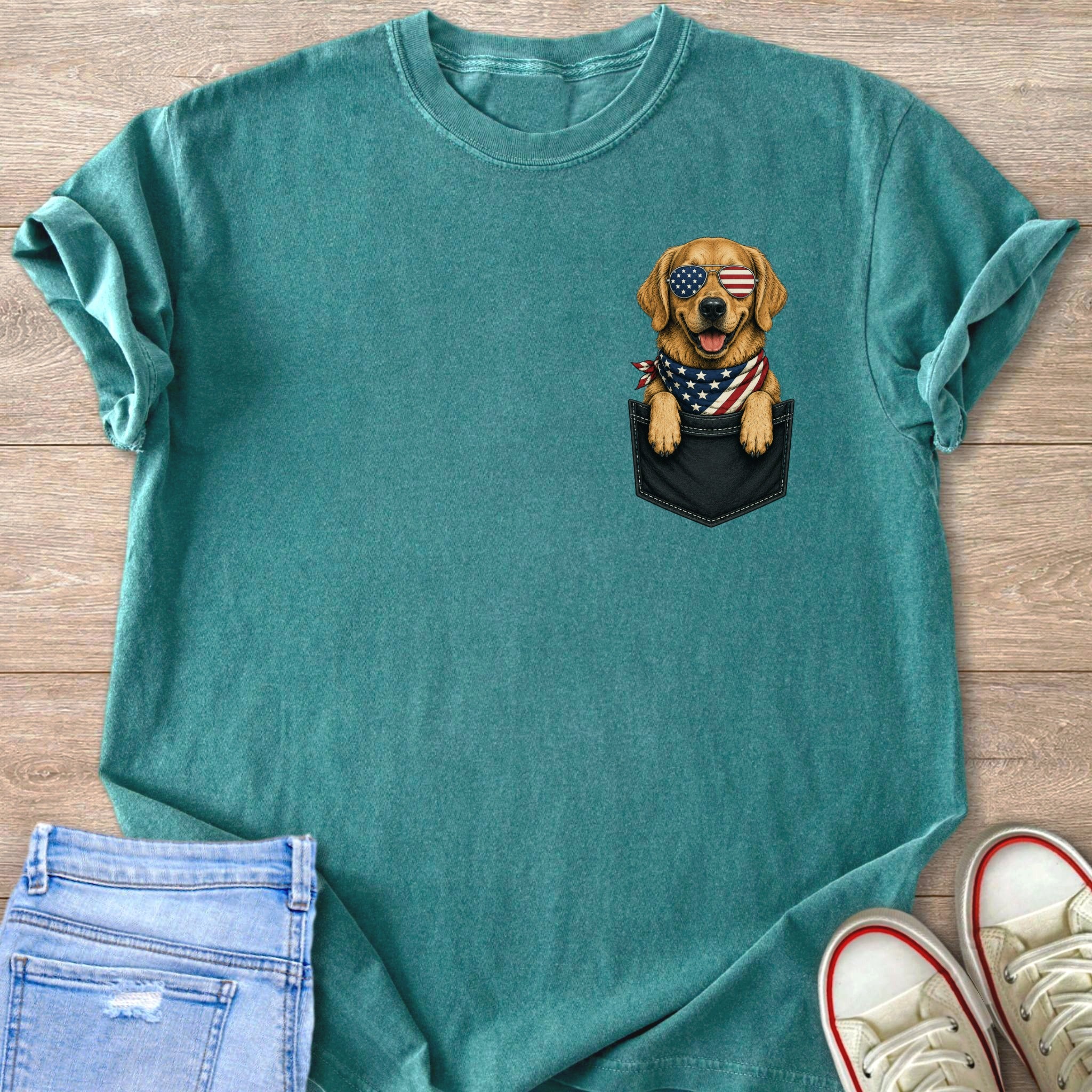 Golden Retriever dog wearing American flag bandana and sunglasses peeking from pocket.