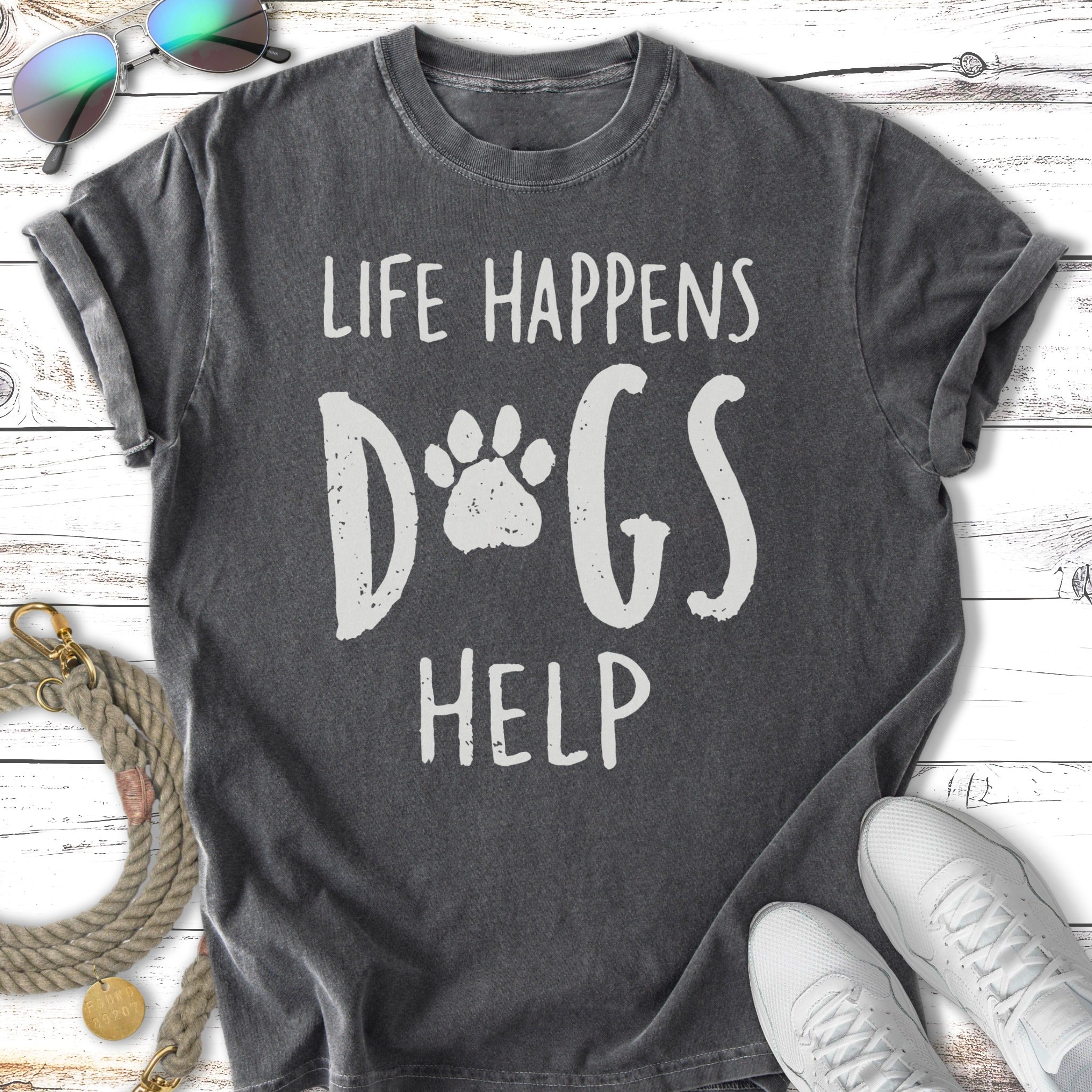 Dark gray t-shirt with white text: "Life Happens Dogs Help" and paw print.