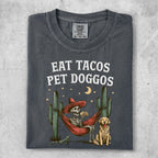 Skeleton in hammock with tacos and dog, wearing Comfort Colors XL t-shirt.