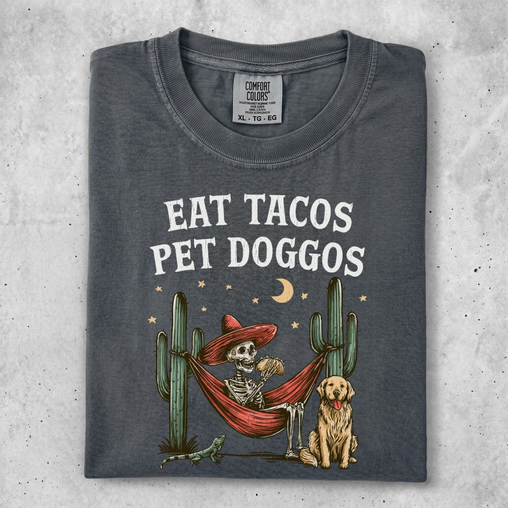 Skeleton in hammock with tacos and dog, wearing Comfort Colors XL t-shirt.