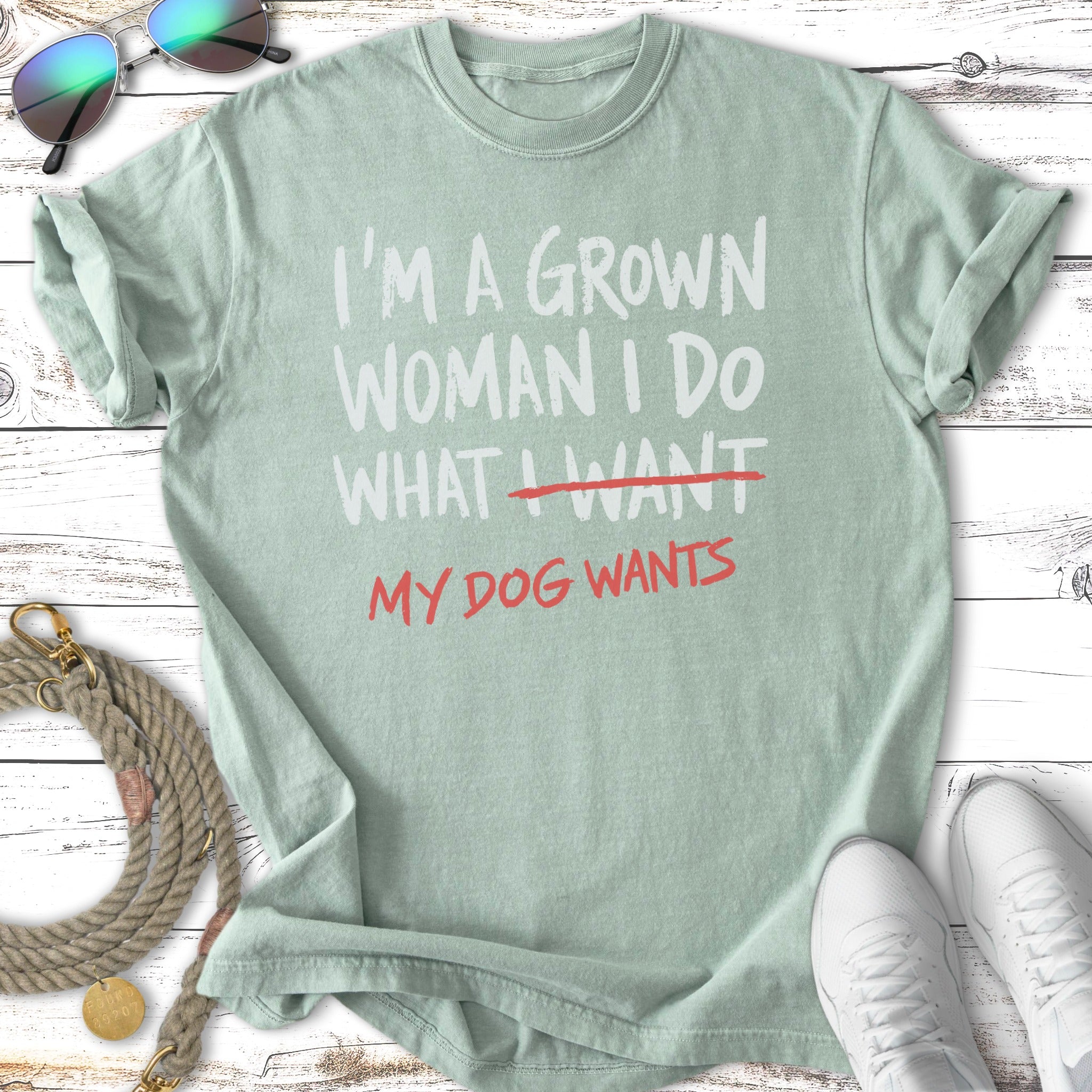 Green t-shirt with text "I'm a grown woman I do what I want, my dog wants".