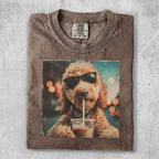 Brown t-shirt with print of a dog wearing sunglasses drinking coffee.