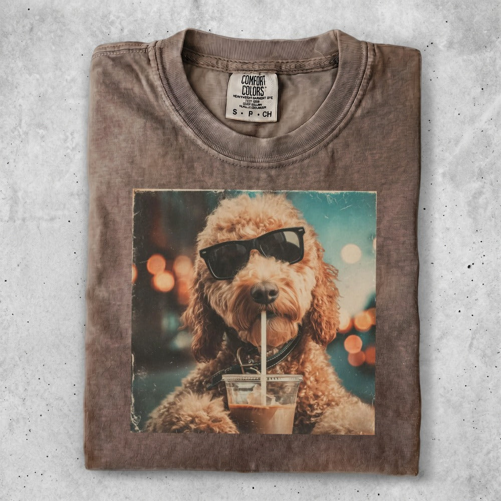Brown t-shirt with print of a dog wearing sunglasses drinking coffee.