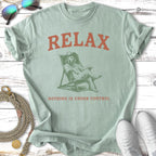 Mint green t-shirt with a dog relaxing in a chair and the text "RELAX NOTHING IS UNDER CONTROL".