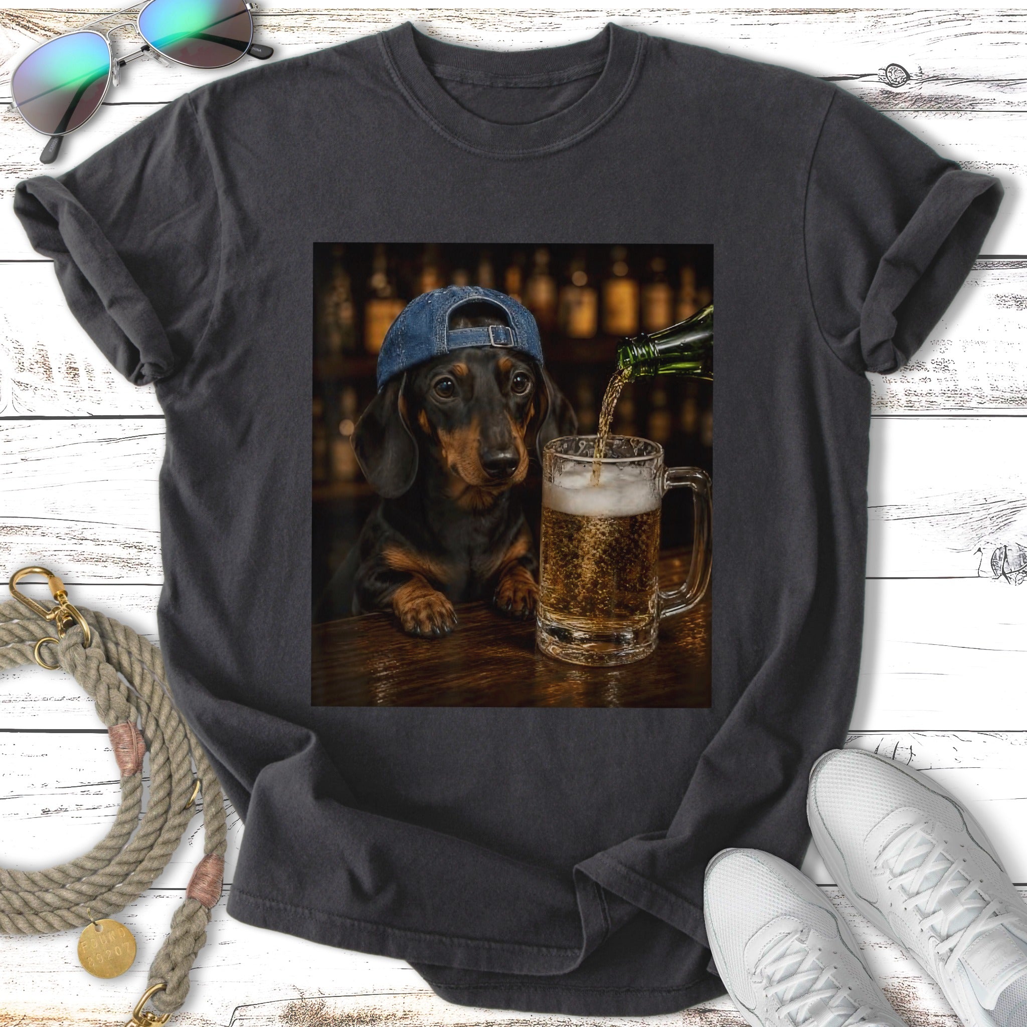 Dachshund wearing a blue cap pours beer into a mug.