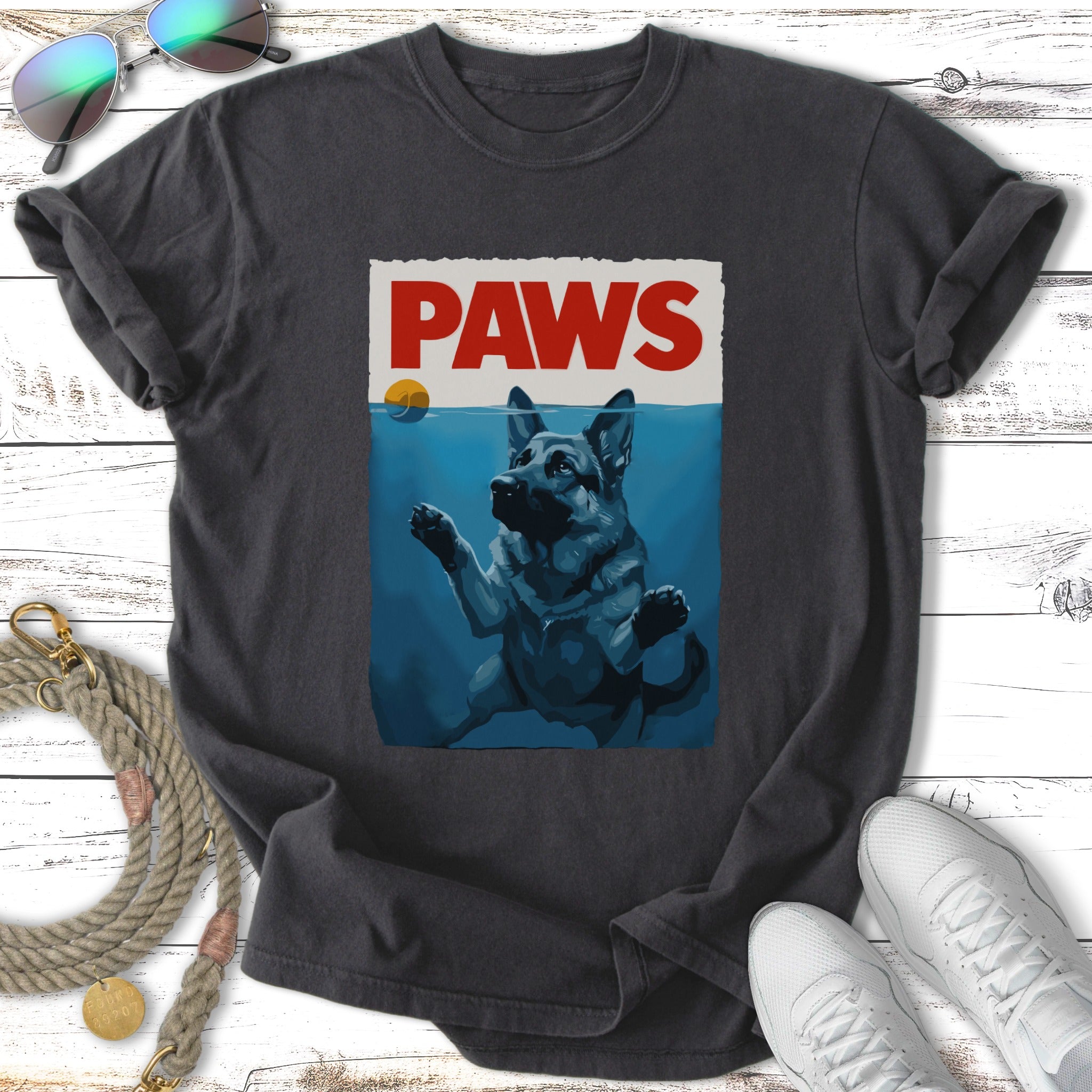German Shepherd underwater reaching for "PAWS" text and a sun.