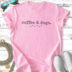 Pink t-shirt with "coffee & dogs" text and paw print graphic.