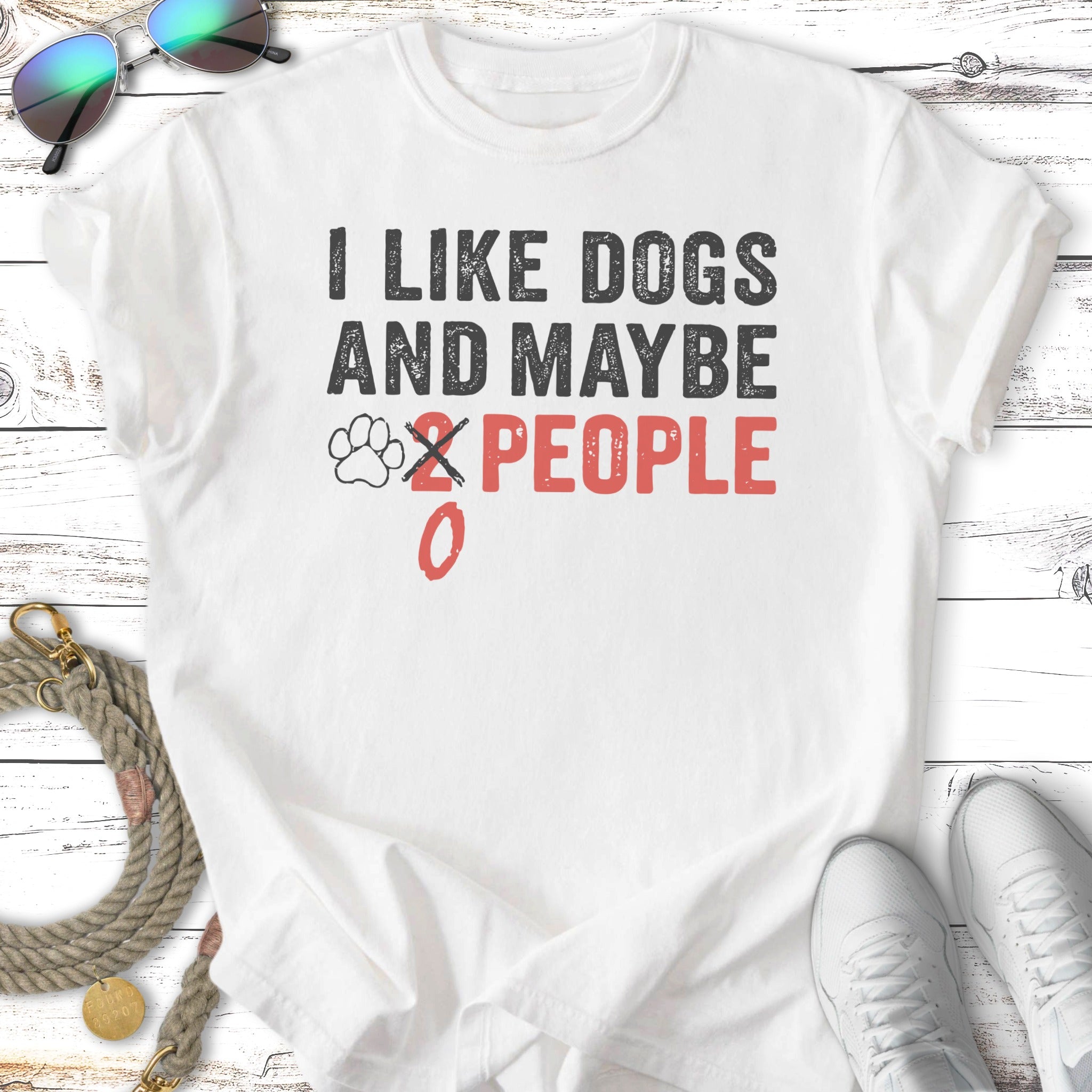 White t-shirt with black text "I LIKE DOGS AND MAYBE 0 PEOPLE".